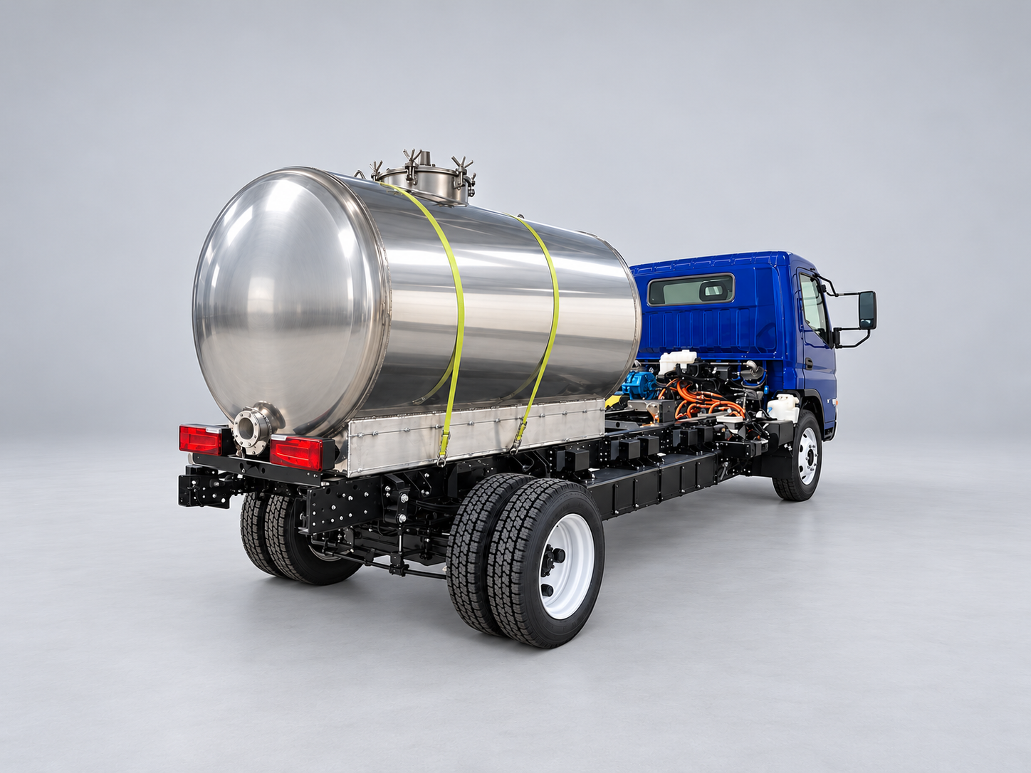 Blue RIZON truck with a stainless-steel vacuum tank body, viewed from the rear.