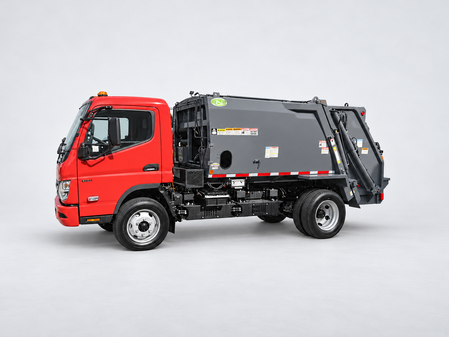Red RIZON truck with a gray rear-loading refuse body.